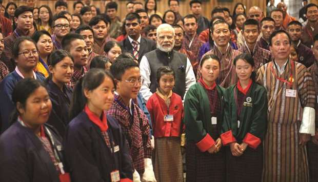 Prime Minister Narendra Modi poses for a photograph with students at the Royal University of Bhutan in Thimpu yesterday.