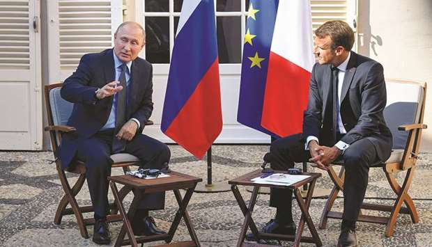 Macron with Putin at the French presidentu2019s summer retreat of the Bregancon fortress, on the Mediterranean coast, near the village of Bormes-les-Mimosas, southern France.