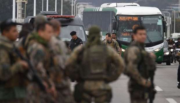 The bus in which a gunman held 31 hostages before being shot dead by police is being taken away, in Rio de Janeiro, Brazil