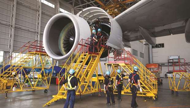 Employees work on an Airbus A380-800 aircraft in a hangar at Incheon International Airport in South Korea. A titanium part is the centrepiece of a 3-metre-wide fan on engines built for A380s by US-based Engine Alliance, co-owned by General Electric and United Technologies unit Pratt & Whitney.
