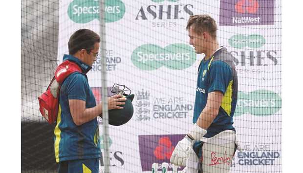 Australia team doctor Richard Saw (left) inspects Marnus Labuschagneu2019s helmet during nets ahead of the third Ashes Test against England at Headingley in Leeds, England. (Reuters)