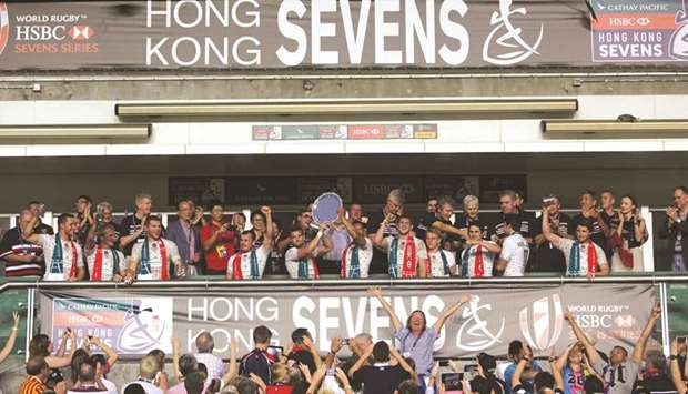 In this April 10, 2016, picture, Englandu2019s players raising the trophy after beating the United States for the Plate Final on the third day of the Hong Kong Rugby Sevens tournament. (AFP)