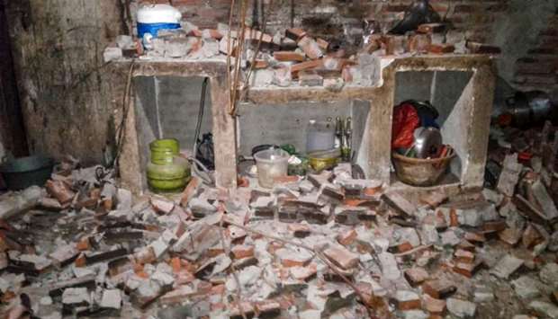 A wall of a villager's house collapsed after a strong earthquake hit Sukasari village in Lebak, Banten province.
