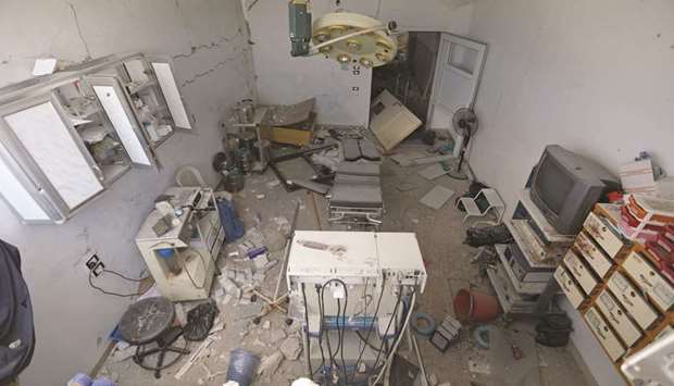 This picture taken yesterday shows the damaged interior of an operating room following a reported air strike on a makeshift clinic in the area of Tallmannis in northern Idlib province.