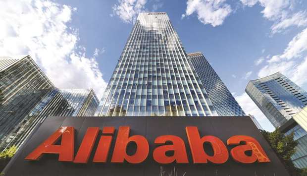 The company sign of Alibaba Group Holding is seen outside its Beijing headquarters in China. The biggest e-commerce company in China has delayed its up to $15bn listing in Hong Kong amid growing political unrest in the Asian financial hub, according to people with knowledge of the matter.