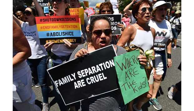 In this file photo taken on June 28, 2018, people demonstrate in Washington, DC demanding an end to the separation of migrant children from their parents.