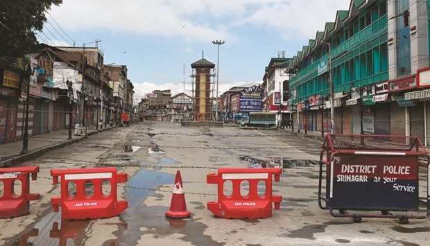 The clock tower is seen at the deserted Lal Chowk during a security lockdown in Srinagar.