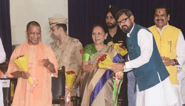Uttar Pradesh Governor Anandiben Patel congratulates one of the newly-sworn in ministers in Lucknow yesterday.