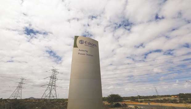 Pylons carry electricity from a sub-station of state power utility Eskom outside Cape Town (file). The governmentu2019s plan to give Eskom 128bn rand in assistance over three years will add to state liabilities and widen the fiscal shortfall.