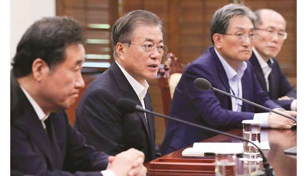 South Korean President Moon Jae-in (centre) attends a meeting at the presidential Blue House in Seoul yesterday.