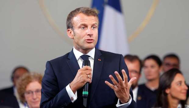 French President Emmanuel Macron delivers a speech on environment and social equality to business leaders on the eve of the G7 summit in Paris