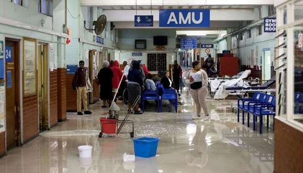 Cleaners mop up water at King Edward VIII Hospital during a storm in Durban, South Africa. File picture: October 10, 2017