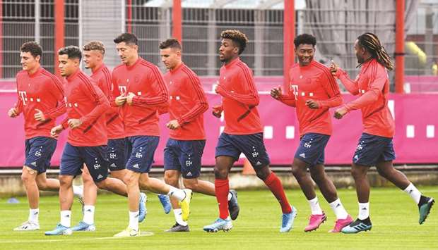 Bayern Munich players train in Munich yesterday on the eve of their match against Schalke.  (AFP)