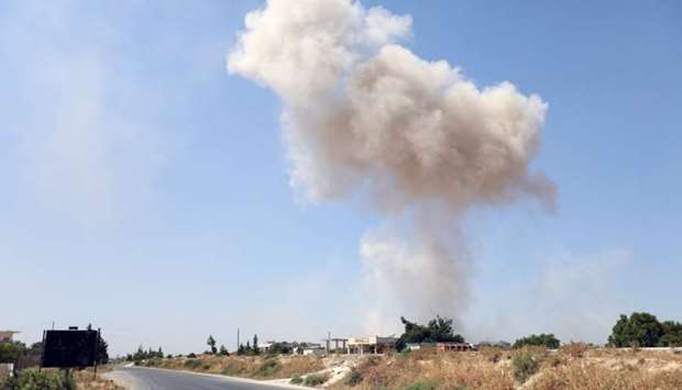Smoke billows following a reported regime air strike on the eastern outskirts of Maaret al-Numan in Syria's northern province of Idlib