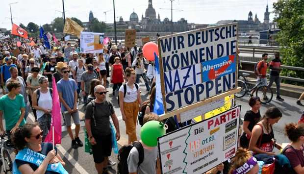 Protesters take part in a demonstration titled ,Unteilbar, (indivisible) against exclusion in Dresden, eastern Germany.