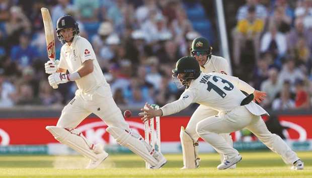 Englandu2019s Joe Root (left) in action on the third day of the third Test against Australia at Headingley in Leeds, United Kingdom, yesterday. (Reuters)