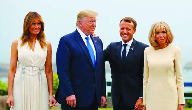 Macron (2ndR) and his wife Brigitte Macron (R) pose with Trump (2ndL) and US First Lady Melania Trump at the Biarritz lighthouse, southwestern France, ahead of a working dinner