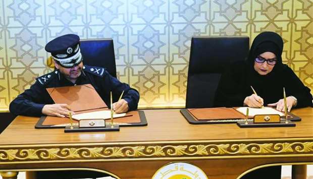 Officials of the Ministry of Interior (MoI) and the Qatar Foundation for Social Work (QFSW) signing the agreement
