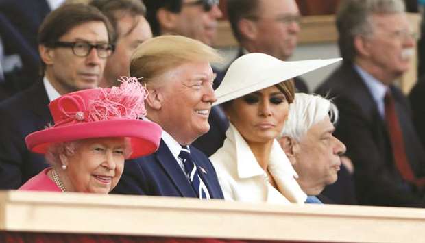 Britainu2019s Queen Elizabeth II (left), US President Donald Trump (centre), and US First Lady Melania Trump attend a ceremony to mark the 75th Anniversary of D-Day in Portsmouth, UK on June 5. Trump has promised a big trade deal for Britain after it leaves the European Union, which he said had been a drag on Britainu2019s ability to cut a good deal.