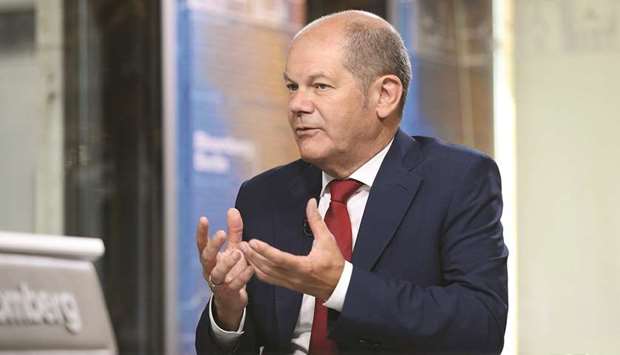 Olaf Scholz, Germanyu2019s finance minister, gestures while speaking during a Bloomberg Television interview in Berlin. Scholz says heu2019ll look into whether itu2019s possible to prevent German banks from charging most retail-banking clients for deposits, after such a measure was proposed by the leader of Bavaria. Lenders have rejected the idea, saying bans donu2019t ultimately help clients and could even destabilise financial markets.