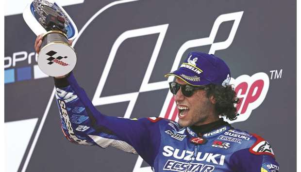 Suzuki Ecstaru2019s Alex Rins celebrates on the podium. (AFP)