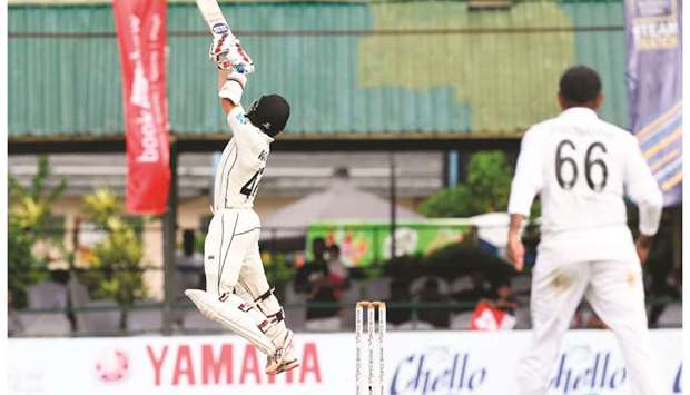 New Zealandu2019s  B J Watling leaps into the air while playing a shot during the fourth day of the second Test match against Sri Lanka  at P. Sara Oval cricket stadium in Colombo yesterday.