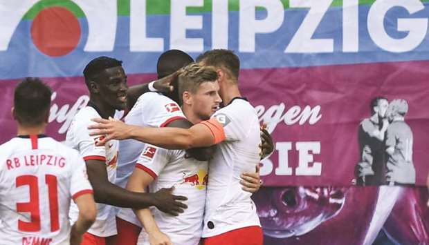 Leipzigu2019s German forward Timo Werner (second right) celebrates after scoring during the Bundesliga football match against Eintracht Frankfurt in Leipzig, eastern Germany, yesterday. (AFP)