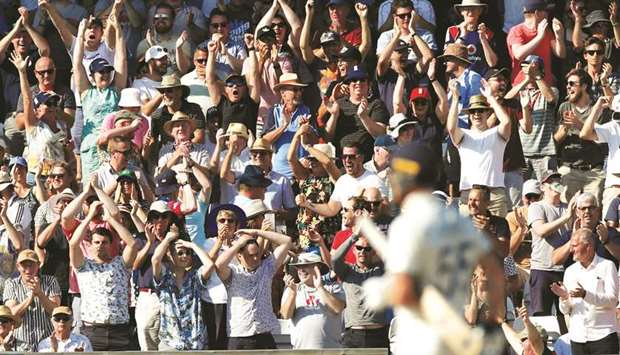 England fans celebrate after Ben Stokes hit a six.