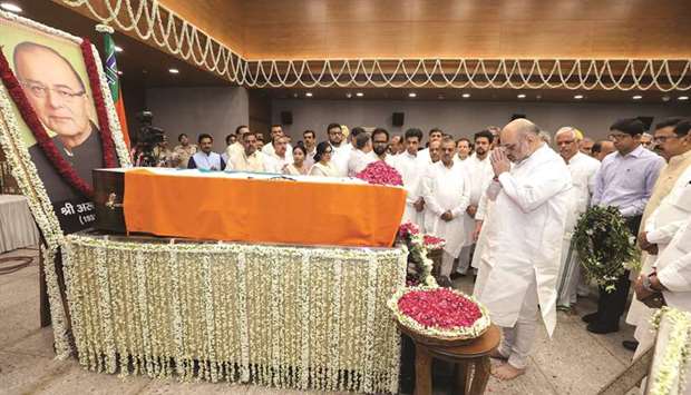 Home Minister Amit Shah pays tributes to former finance minister Arun Jaitley at the BJP headquarters in New Delhi yesterday.