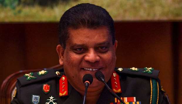 Sri Lanka's new army chief Lieutenant General Shavendra Silva reacts as he speaks during a press conference in Colombo