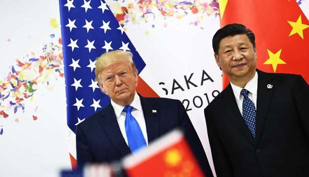 Chinese President Xi Jinping (R) and US President Donald Trump attend their bilateral meeting on the sidelines of the G20 Summit in Osaka on June 29.