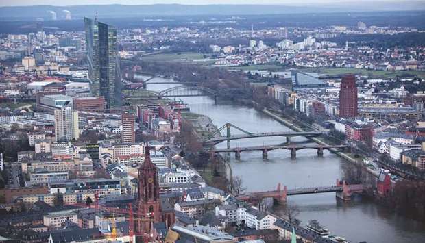The skyscraper headquarter offices of the European Central Bank (left) and commercial and residential property stand beside the River Main in Frankfurt. Germanyu2019s manufacturers are now struggling with weaker foreign demand, tariff disputes sparked by US President Donald Trump and business uncertainty linked to Britainu2019s decision to leave the EU.