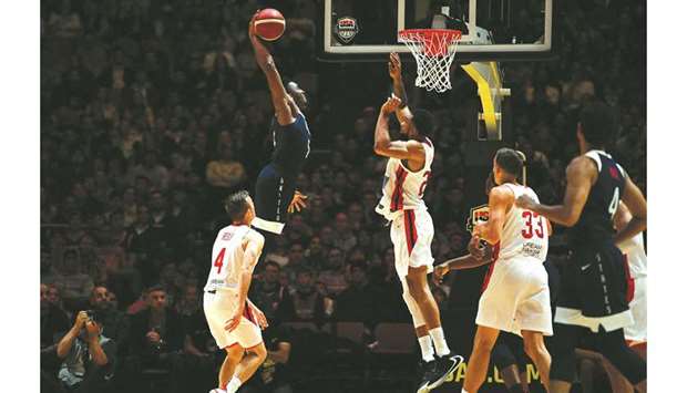 Donovan Mitchell (left) of the US shoots at the basket during the friendly match against Canada in Sydney. (AFP)