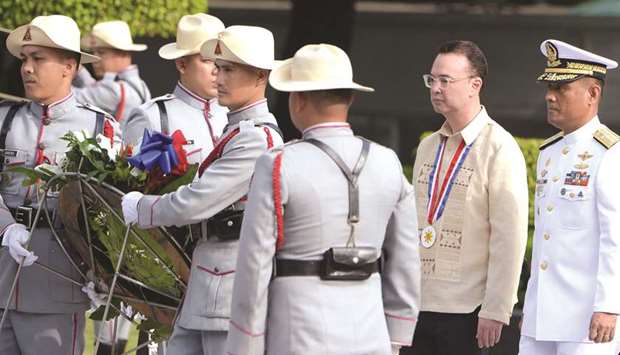 Speaker of the House Peter Cayetano (second right) walks with honour guards during a wreath-laying ceremony at the Tomb of the Unknown Soldier in Manila, yesterday.