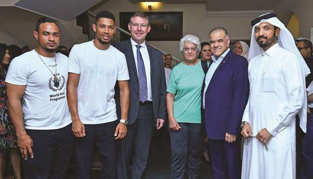 South Africau2019s Wayde van Niekerk (second from left), his coach Ans Botha (third from right) and South Africau2019s ambassador to Qatar Faizel Moosa (second from right) at an event at the South African embassy yesterday. PICTURES: Ram Chand