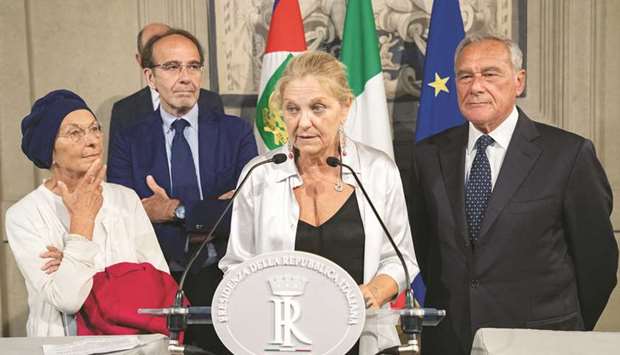 Italian Senator Loredana De Petris speaks to the media as Senators Riccardo Nencini, Emma Bonino and Pietro Grasso look on in Rome yesterday.