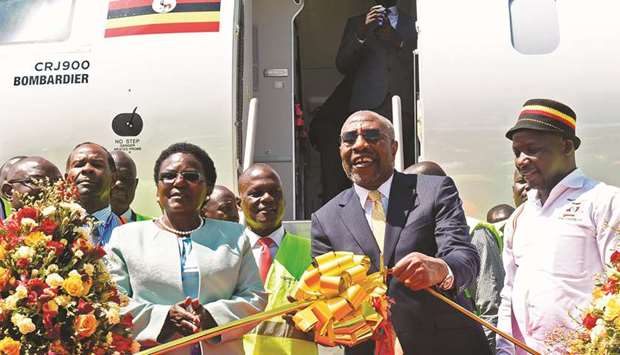 Ugandau2019s Prime Minister Ruhakana Rugunda (second right) flanked by Minister of World and Transport Eng. Monica Azuba Ntege (second left) and the State Minister for Tourism Godfrey Kiwanda (right) take part in the launching ceremony of Uganda Airlineu2019s maiden flight to Jomo Kenyatta International Airport in Nairobi, yesterday.