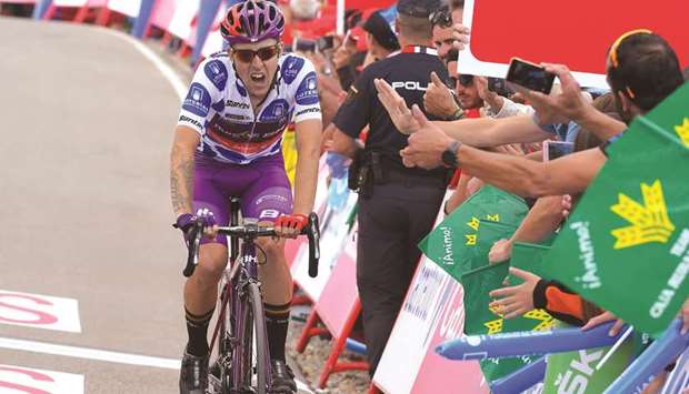 Team Burgos BH rider Spainu2019s Angel Madrazo crosses the finish line to win the fifth stage of the 2019 La Vuelta cycling tour of Spain, a 170.7km race from Lu2019Eliana and Alto de Javalambre, in Javalambre, Spain, yesterday. (AFP)
