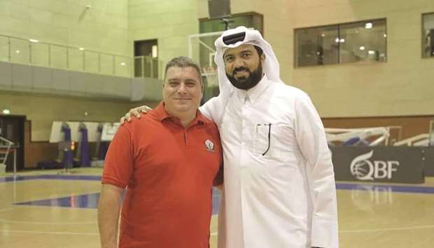 Qatar Basketball Federation Secretary-General Ali Saeed al-Malki, right, with Miro.