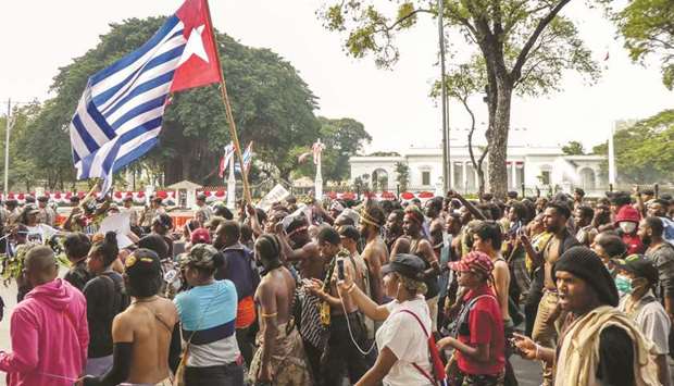 Papuans take part in a rally in front of the presidential palace and army headquarters in Jakarta yesterday, in the latest protest after riots and demonstrations last week brought several Papuan cities in eastern Indonesia to a standstill.