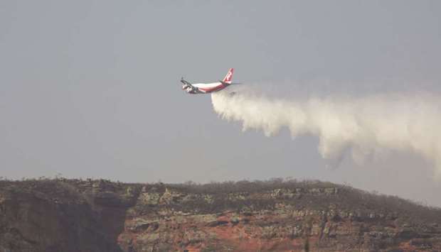 A SuperTanker aircraft releases water over Ipias, an area where wildfires have destroyed hectares of forest, near Robore, Bolivia. The B747-400 SuperTanker is in the category of Very Large Airtankers (VLAT), capable of dropping around 19,000 gallons of retardant per trip, according to the companyu2019s website. Recently, Bolivia took delivery of the SuperTanker, said to be the worldu2019s largest firefighting plane.