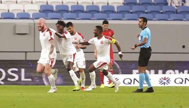 Aron Gunnarson celebrates as he his congratulated by Al Arabi players after he scored the equaliser against Al Duhail yesterday. PICTURE: Ram Chand