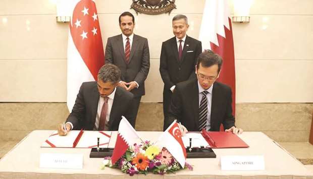 The dignitaries witnessed the signing of a memorandum of understanding yesterday in Singapore.