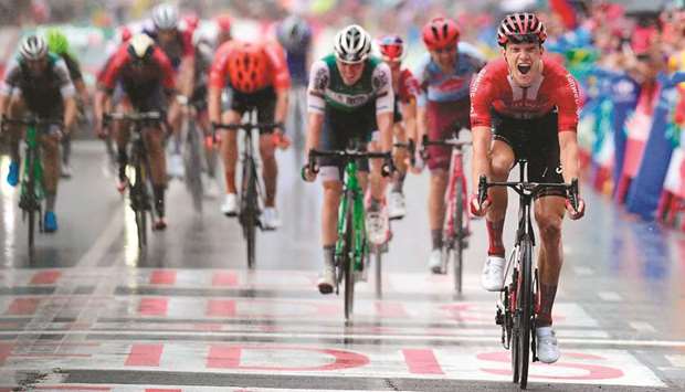 Team Sunweb rider Germanyu2019s Nikias Arndt celebrates as he crosses the finish line and wins the eighth stage of the 2019 La Vuelta cycling tour of Spain in Igualada yesterday. (AFP)