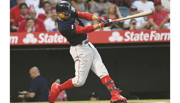 Boston Red Soxu2019s Mookie Betts hits a solo home run against the LA Angels during the first inning of their MLB game on Friday in Anaheim, United States. (USA TODAY Sports)