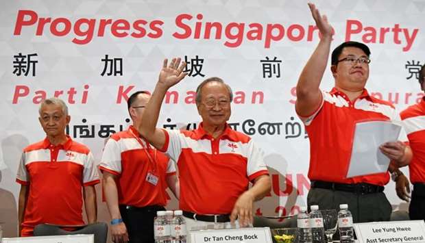 Tan Cheng Bock (2nd R), Secretary General of the Progress Singapore Party (PSP), waves at the party's launch in Singapore
