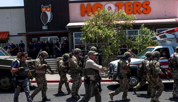 Law enforcement agencies respond to an active shooter at a Wal-Mart near Cielo Vista Mall in El Paso, Texas