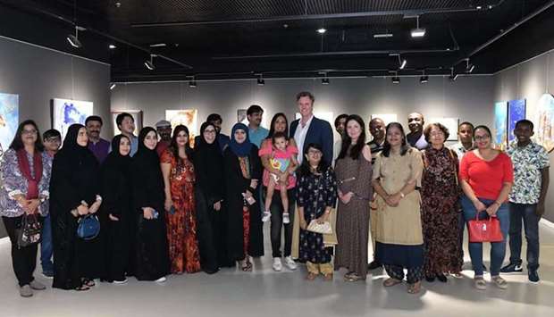 GROUP: Artists, guests and organisers of the exhibition pose for a group photo.