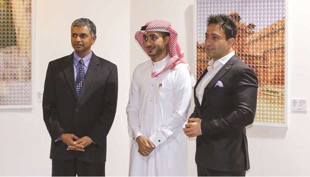 Indian ambassador P Kumaran, artist Ahmed al-Jufairi, and W Doha general manager Wassim Daaje at the opening reception of the exhibition.