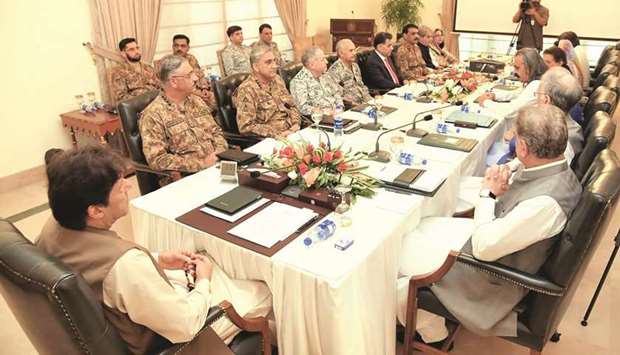 This handout picture released by the Press Information Department (PID) shows Prime Minister Imran Khan chairing the National Security Committee meeting in Islamabad. Fears of an impending curfew in the disputed region of Kashmir ratcheted up tensions yesterday, as nuclear rivals India and Pakistan traded accusations of military clashes at the de facto border.